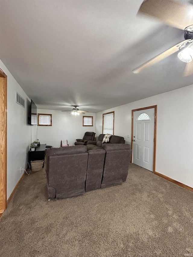 312 W Columbia St, Oakland City, IN 47660 - living area with a ceiling fan, carpet floors, and baseboards