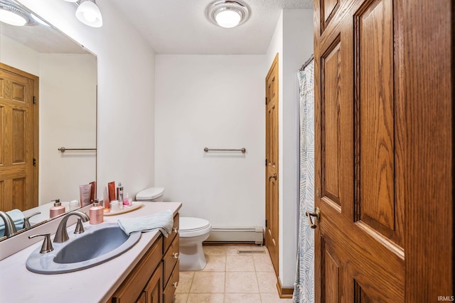 13392 N State Road 13, North Manchester, IN 46962 - full bathroom with a baseboard radiator, toilet, tile patterned floors, and vanity