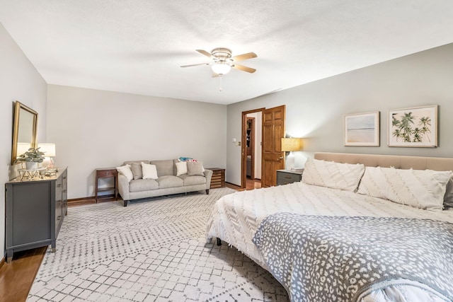 13392 N State Road 13, North Manchester, IN 46962 - bedroom featuring baseboards, wood finished floors, and a ceiling fan