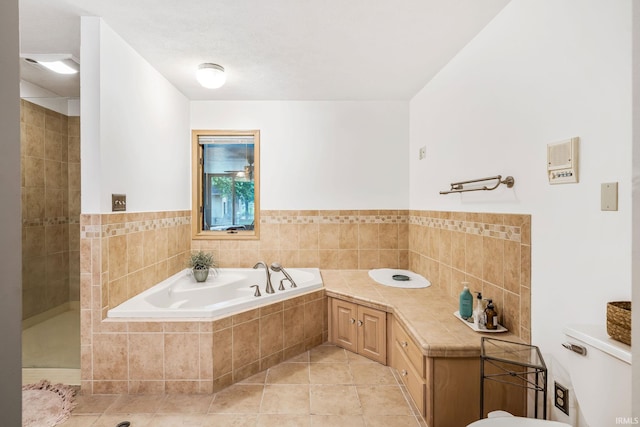 13392 N State Road 13, North Manchester, IN 46962 - bathroom with tile patterned floors, a garden tub, toilet, and tiled shower