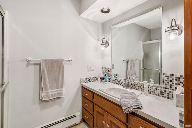 13392 N State Road 13, North Manchester, IN 46962 - bathroom featuring baseboard heating, tasteful backsplash, a shower stall, and vanity