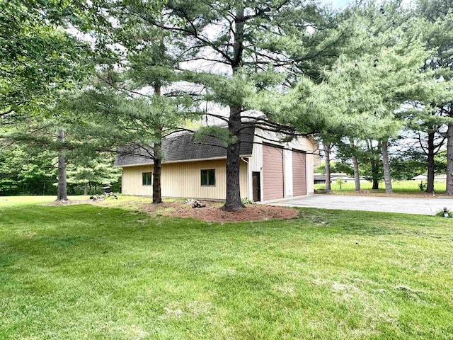 13392 N State Road 13, North Manchester, IN 46962 - view of home's exterior with a yard, driveway, a garage, and a shingled roof