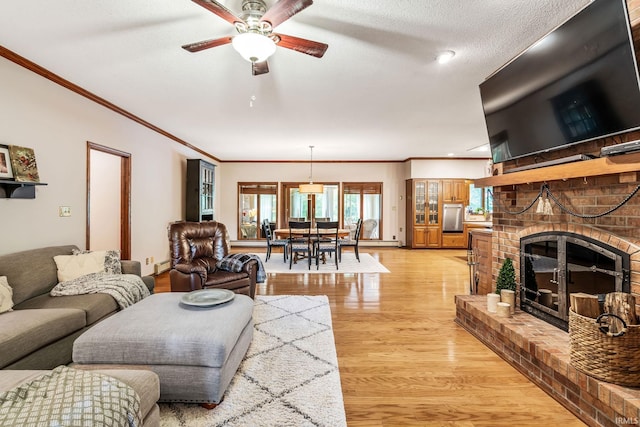 13392 N State Road 13, North Manchester, IN 46962 - living area with light wood-style floors, a ceiling fan, crown molding, and a brick fireplace