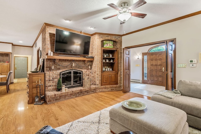 13392 N State Road 13, North Manchester, IN 46962 - living room with built in shelves, crown molding, wood finished floors, baseboard heating, and a fireplace