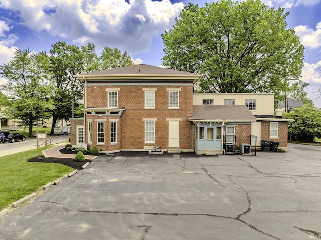 607 E Charles St, Muncie, IN 47305 - view of front of home featuring brick siding and cooling unit