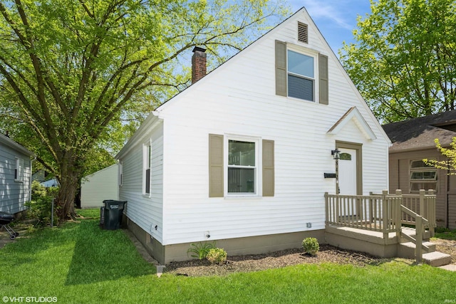 1842 Obrien St, South Bend, IN 46628 - view of front of property with a chimney and a front yard
