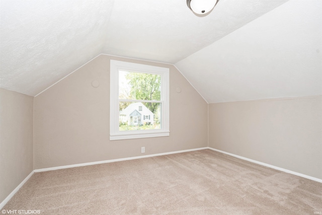 1842 Obrien St, South Bend, IN 46628 - additional living space with carpet floors, lofted ceiling, baseboards, and a textured ceiling