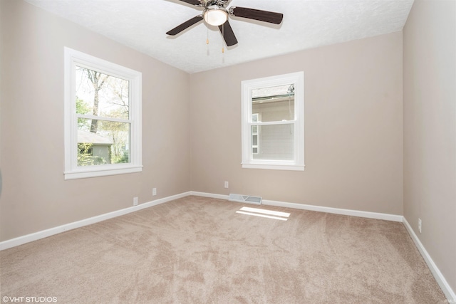 1842 Obrien St, South Bend, IN 46628 - carpeted empty room with baseboards and a ceiling fan