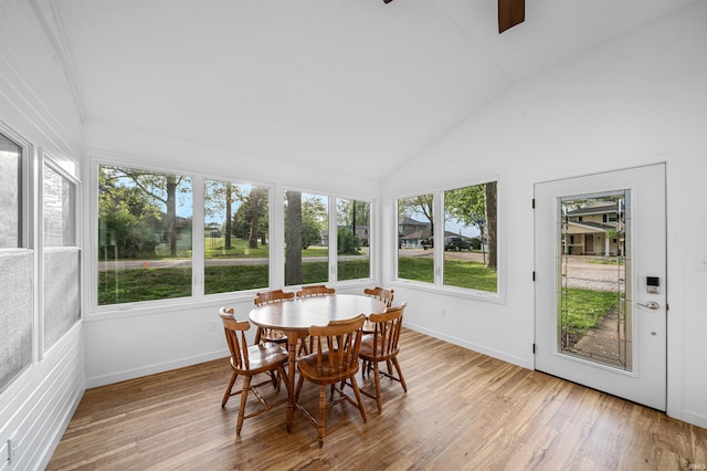 3 Ems T20 Ln, Leesburg, IN 46538 - sunroom featuring a wooden deck, wood finished floors, baseboards, and high vaulted ceiling