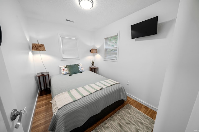 3 Ems T20 Ln, Leesburg, IN 46538 - bedroom with a textured ceiling, baseboards, and wood finished floors