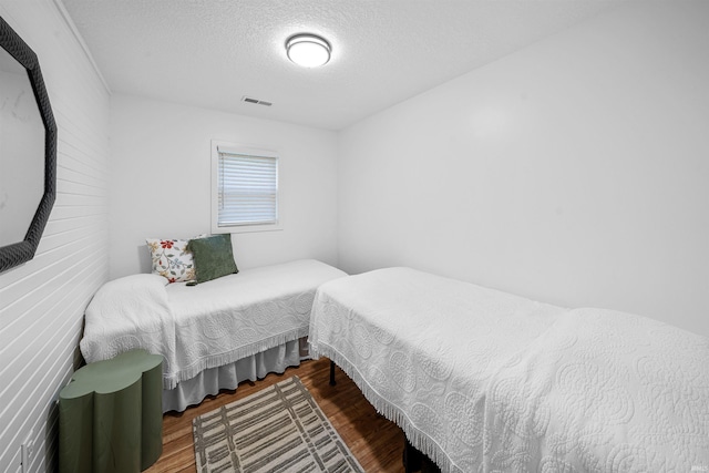 3 Ems T20 Ln, Leesburg, IN 46538 - bedroom with a textured ceiling and wood finished floors
