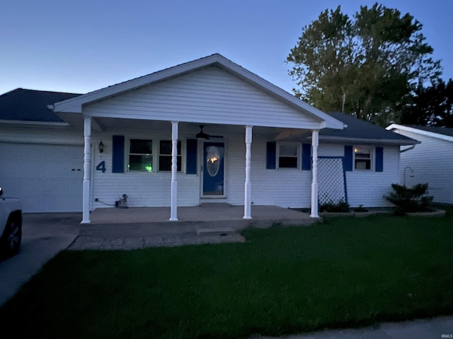 4 Topaz Dr, Huntington, IN 46750 - single story home featuring a porch, a garage, a front lawn, and driveway