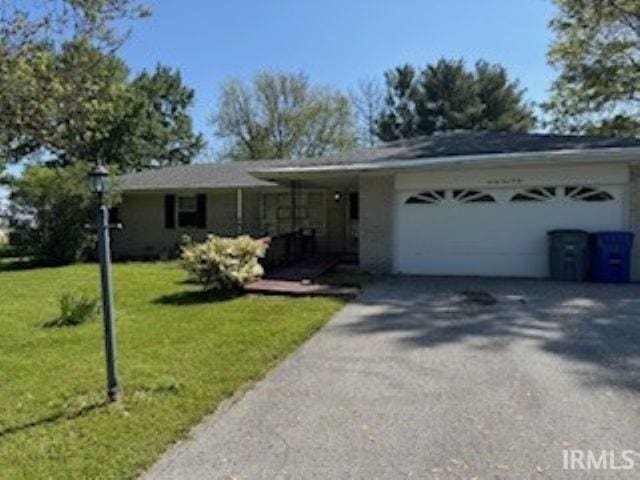 2402 Greytwig Dr, Kokomo, IN 46902 - ranch-style home with a garage, asphalt driveway, and a front yard