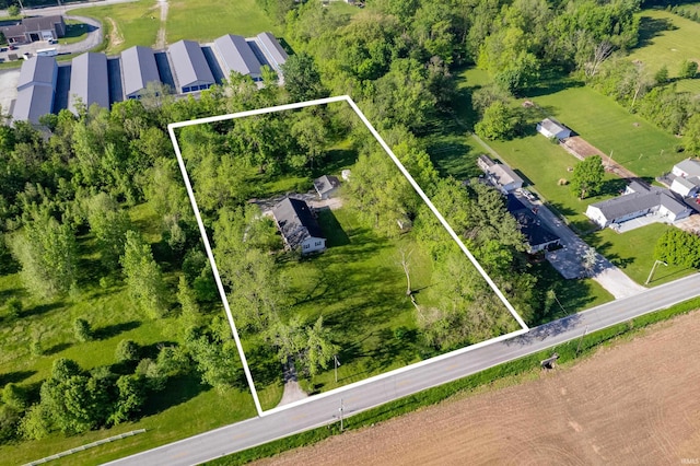 aerial view of property and surrounding area featuring property boundaries highlighted