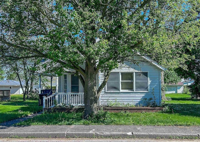 315 W Butcher St, Geneva, IN 46740 - obstructed view of property with a front lawn