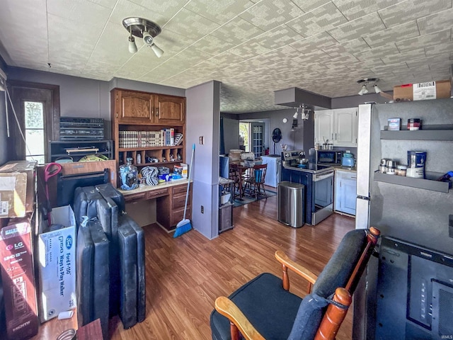 315 W Butcher St, Geneva, IN 46740 - living room featuring wood finished floors and an office area