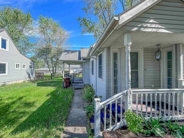 315 W Butcher St, Geneva, IN 46740 - view of grassy yard with covered porch