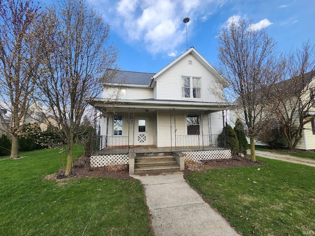 view of front of property with a front lawn and covered porch