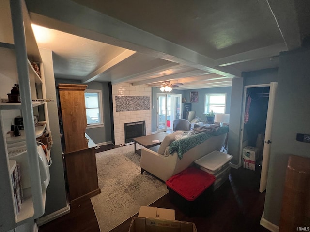 1206 King St, Lafayette, IN 47905 - living room with a brick fireplace, beam ceiling, a ceiling fan, and baseboards