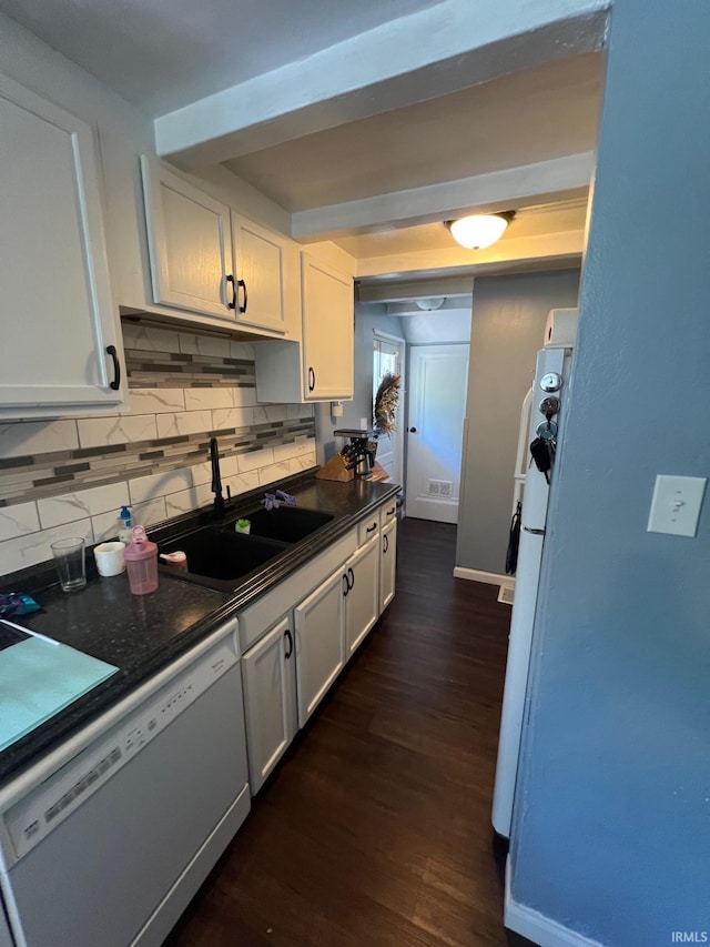 1206 King St, Lafayette, IN 47905 - kitchen with white appliances, a sink, dark countertops, decorative backsplash, and white cabinets