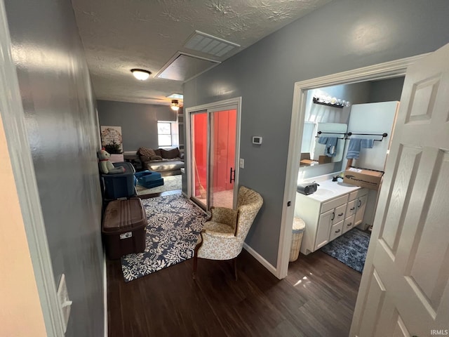 1206 King St, Lafayette, IN 47905 - living area with dark wood finished floors, a textured ceiling, and baseboards