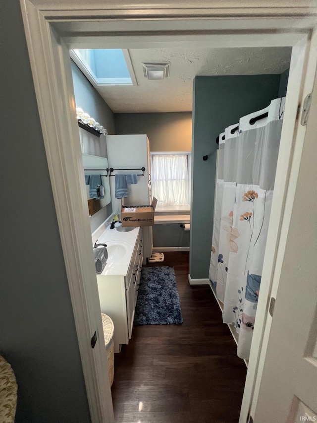 1206 King St, Lafayette, IN 47905 - bathroom with wood finished floors, vanity, baseboards, and curtained shower