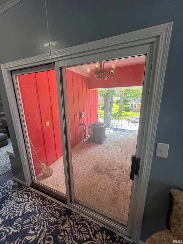 1206 King St, Lafayette, IN 47905 - entryway with carpet flooring and a chandelier
