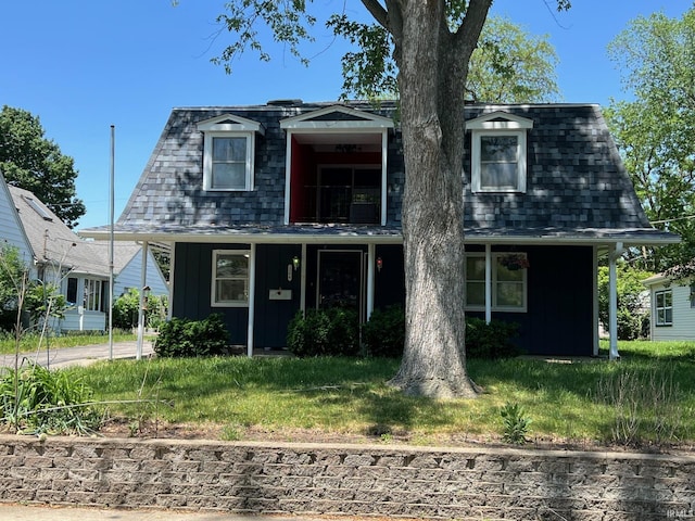1206 King St, Lafayette, IN 47905 - view of front facade with board and batten siding, a balcony, and roof with shingles