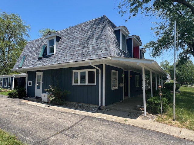1206 King St, Lafayette, IN 47905 - view of front of property featuring mansard roof, a shingled roof, and a porch