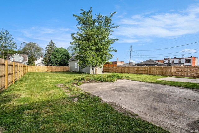 1614 Kendall St, South Bend, IN 46613 - view of yard featuring a patio area and an outdoor structure