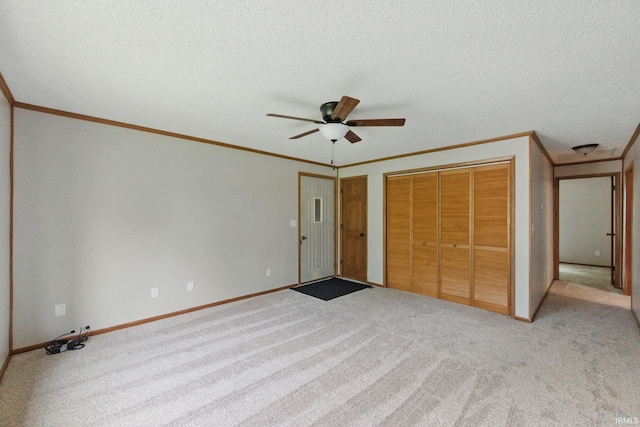 7956 N 225 W, Delphi, IN 46923 - unfurnished bedroom with crown molding, carpet, baseboards, a closet, and ceiling fan
