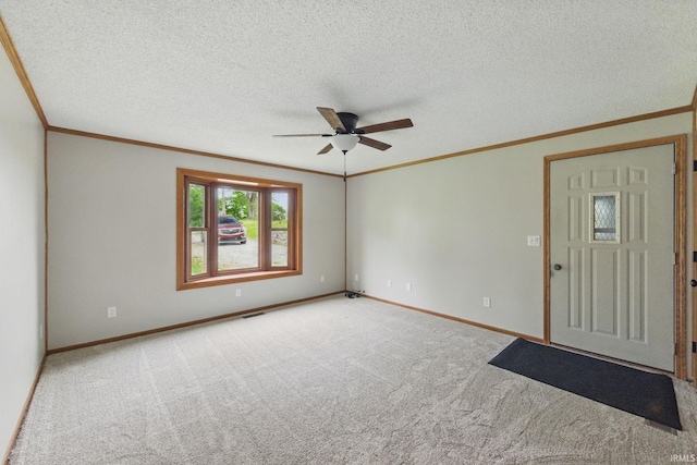 7956 N 225 W, Delphi, IN 46923 - carpeted spare room with crown molding, a ceiling fan, baseboards, and a textured ceiling