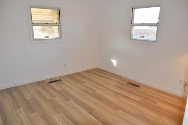 3333 Eastwood Dr, Fort Wayne, IN 46805 - unfurnished room featuring plenty of natural light, light wood-style floors, and baseboards
