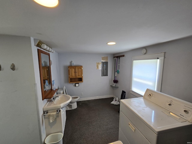 bathroom with washer / clothes dryer, electric panel, toilet, baseboards, and recessed lighting