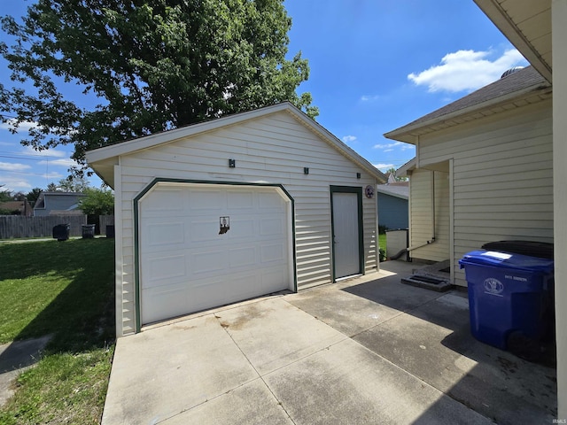 detached garage featuring concrete driveway