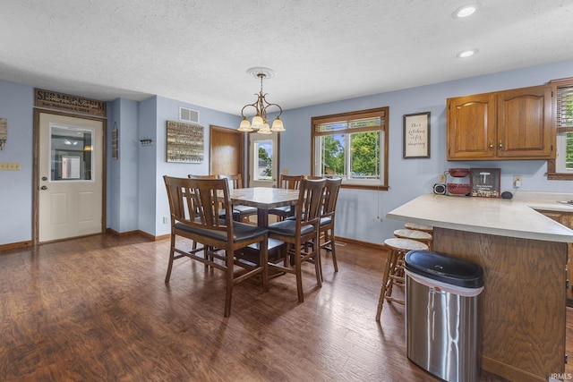 1376 N Hayland Dr, Jasper, IN 47546 - dining area featuring baseboards, dark wood-type flooring, a textured ceiling, recessed lighting, and a chandelier
