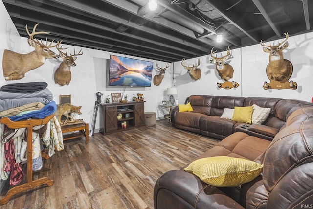 1376 N Hayland Dr, Jasper, IN 47546 - living room featuring hardwood / wood-style flooring and concrete block wall