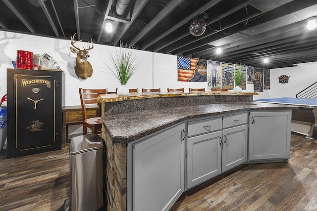 1376 N Hayland Dr, Jasper, IN 47546 - kitchen featuring dark wood-style flooring, dark countertops, and a kitchen island