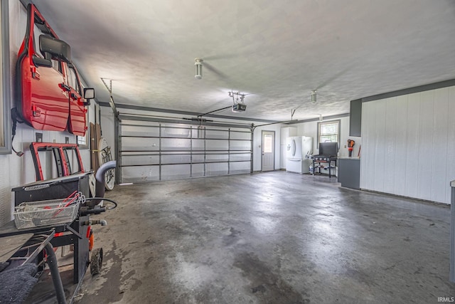 1376 N Hayland Dr, Jasper, IN 47546 - garage featuring freestanding refrigerator and a garage door opener