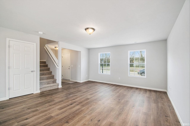 2170 Miami Trl, Huntington, IN 46750 - unfurnished living room with wood finished floors, stairs, and baseboards