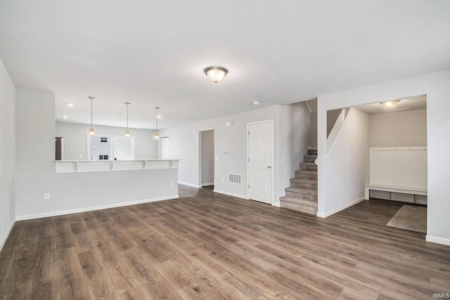 2170 Miami Trl, Huntington, IN 46750 - unfurnished living room with wood finished floors, baseboards, stairs, and recessed lighting