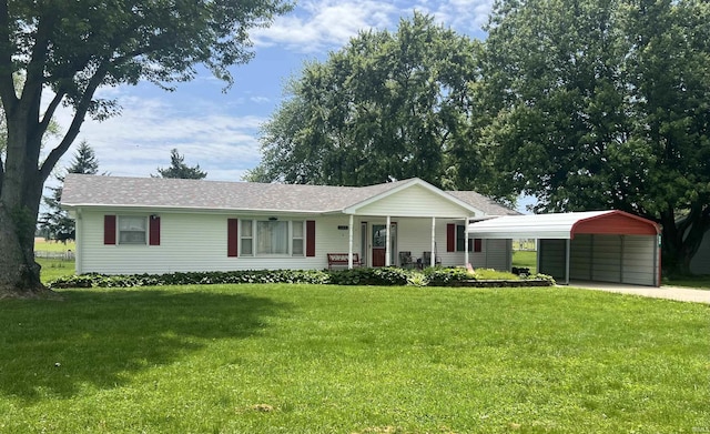 509 E Vincennes St, Orleans, IN 47452 - ranch-style home with a front yard, covered porch, a detached carport, and roof with shingles