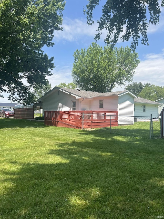 509 E Vincennes St, Orleans, IN 47452 - rear view of house featuring a deck and a shingled roof