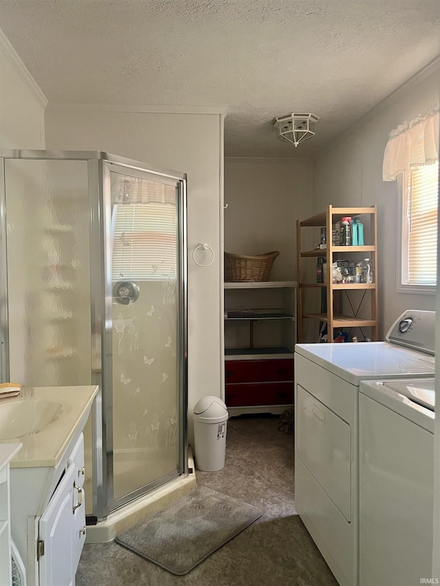 509 E Vincennes St, Orleans, IN 47452 - laundry area with separate washer and dryer, a textured ceiling, crown molding, and a sink