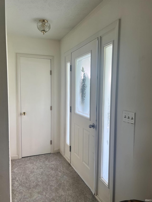 509 E Vincennes St, Orleans, IN 47452 - carpeted entrance foyer featuring a textured ceiling