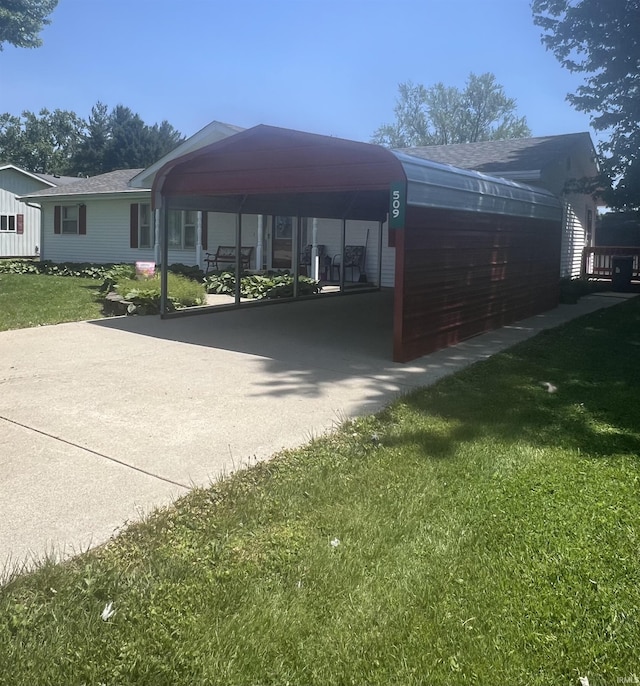 509 E Vincennes St, Orleans, IN 47452 - view of car parking featuring a carport and concrete driveway