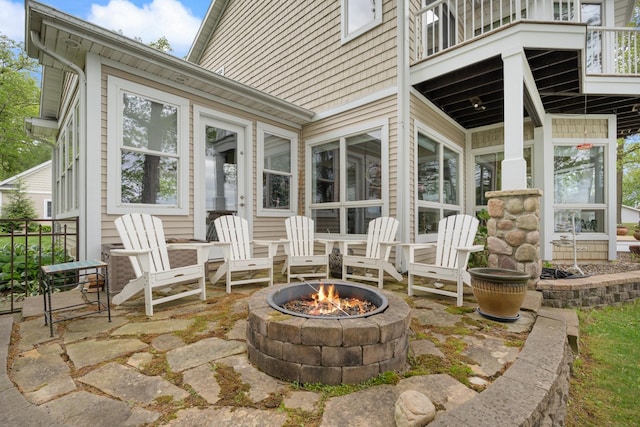 135 Ems D13 Ln, Syracuse, IN 46567 - view of patio / terrace with a balcony and an outdoor fire pit