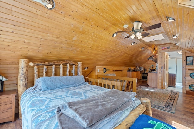 135 Ems D13 Ln, Syracuse, IN 46567 - bedroom featuring wood walls, vaulted ceiling, wooden ceiling, a skylight, and wood finished floors