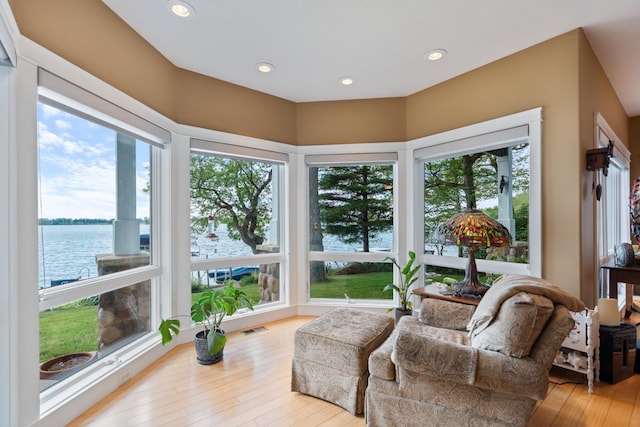 135 Ems D13 Ln, Syracuse, IN 46567 - sunroom / solarium featuring a water view, wood-type flooring, and recessed lighting