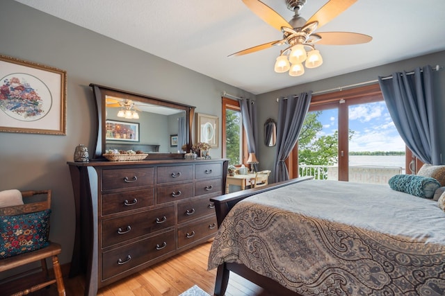 135 Ems D13 Ln, Syracuse, IN 46567 - bedroom with light wood-type flooring, a water view, and ceiling fan